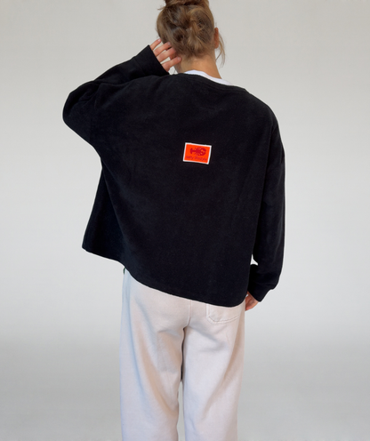 Fleecesweater mit Kangurutasche schwarz „salty lifestyle“